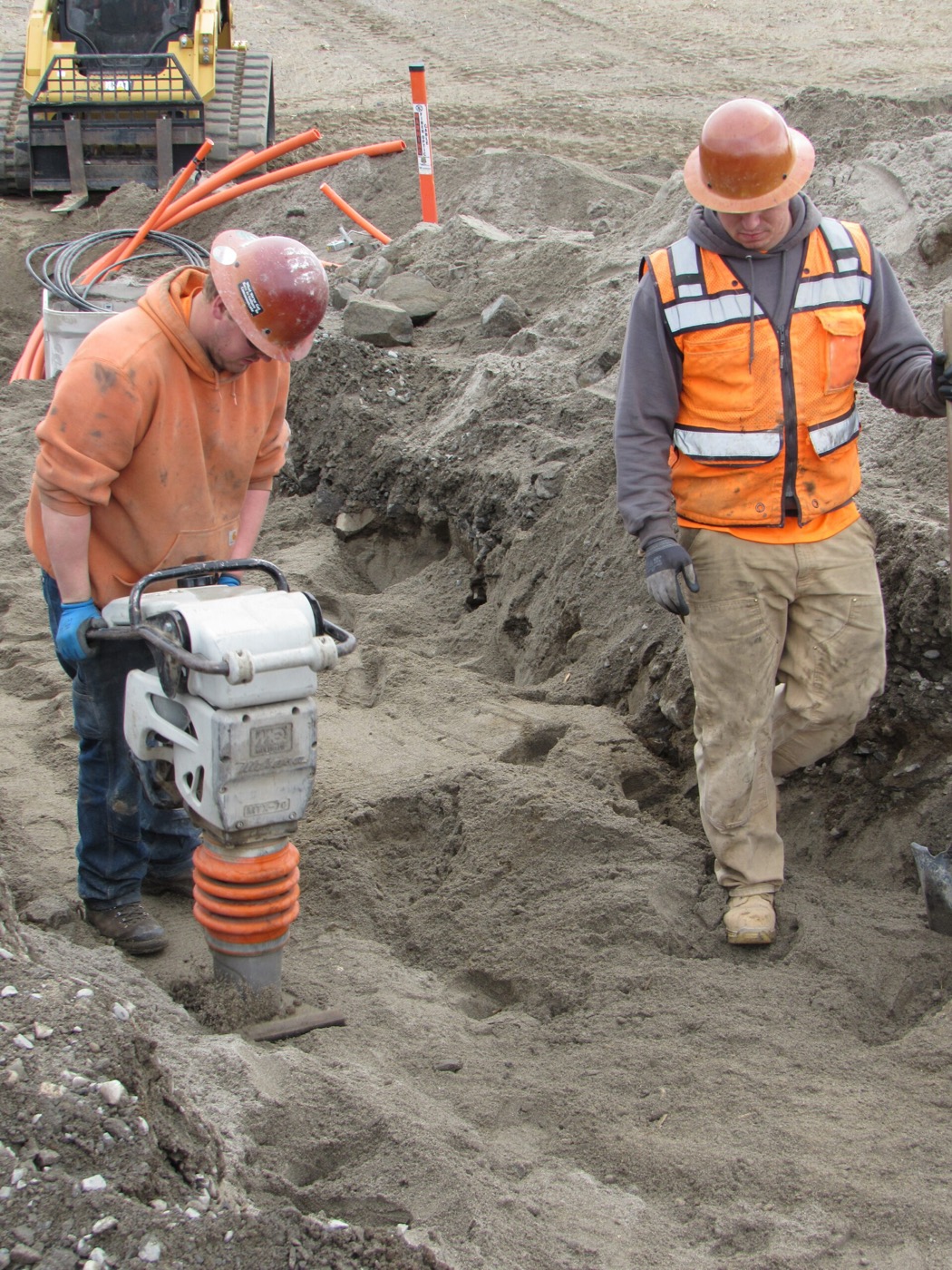 Windwave technician placing fiber optic cable on site